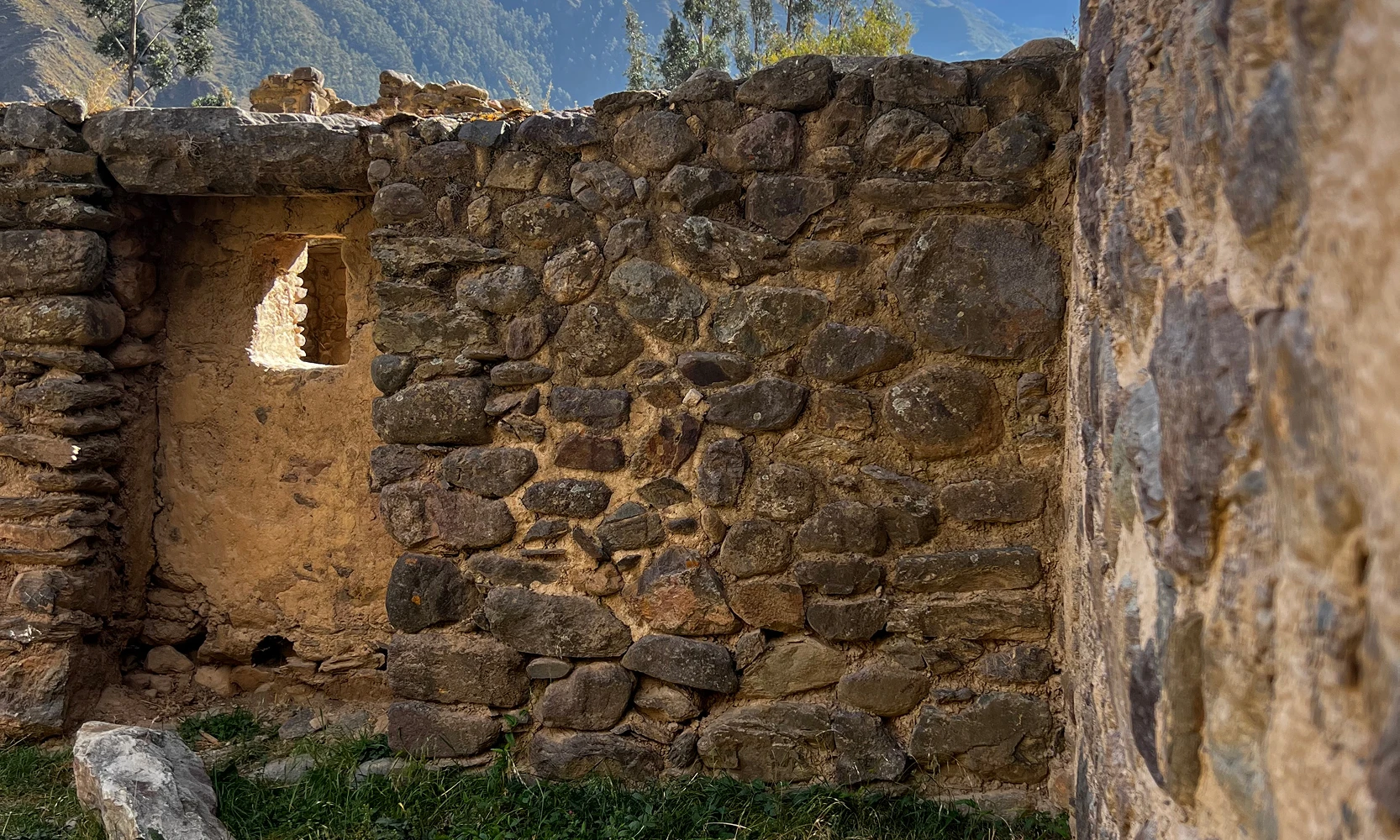 Peaceful landscape at sunrise with a tranquil lake mirroring the golden sky in the Potato Park, Cusco, Peru, Kaymara Luxury Travel.